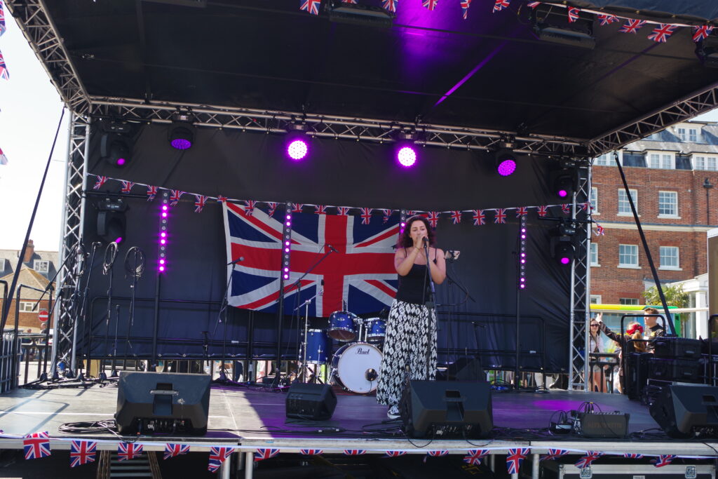 Asha Zee performing on stage.